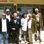 Zu sehen sind Vetreter der Delegation des Lions Club 2013 vor dem Berufsschulzentrum in Kamza